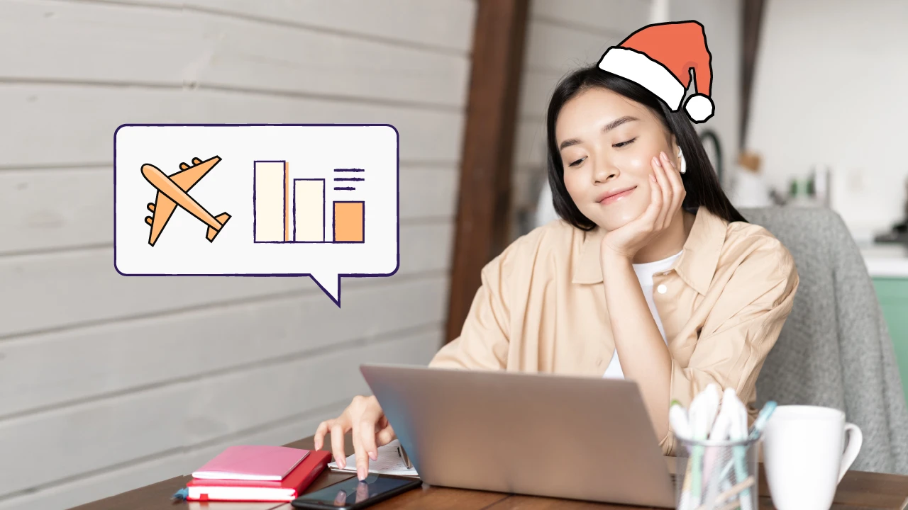 Woman booking holiday travel on her laptop.