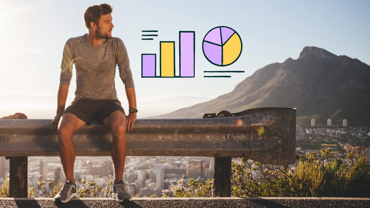 Man on a road looking over a cityscape.