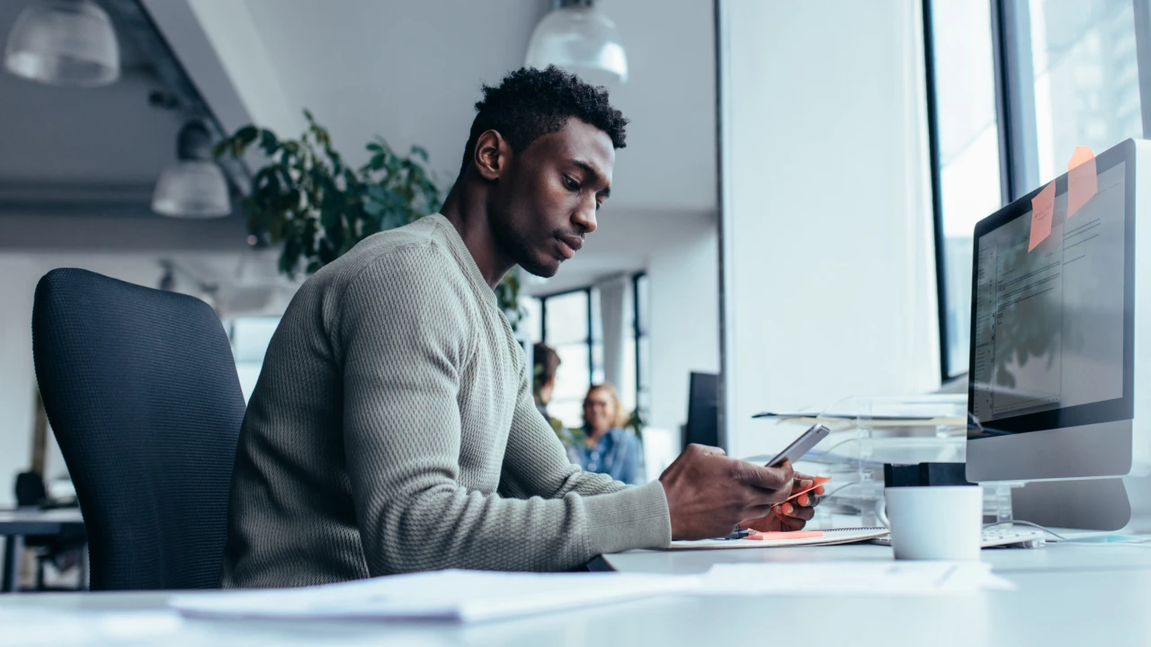 Man looking at his cell phone.