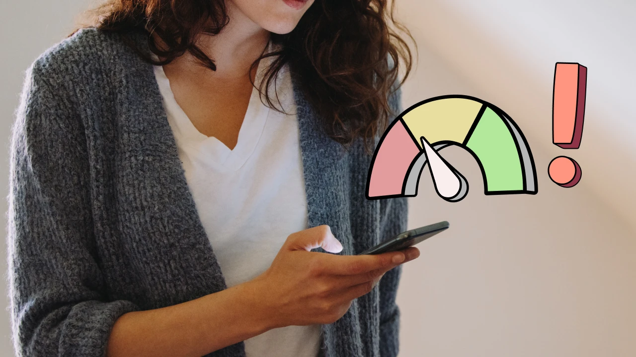 Woman reviewing her credit score on her phone.