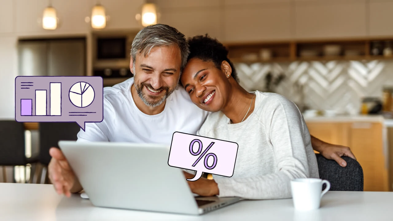A couple reviewing their finances on a computer.