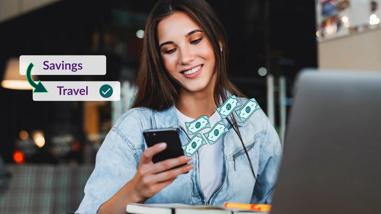Woman setting up automatic savings transfers on her phone.