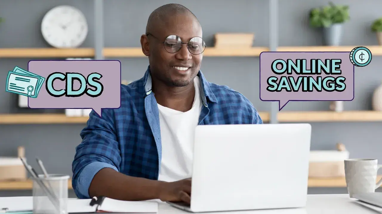 A man researching CDs and online savings accounts on a laptop.