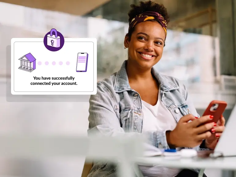 A person smiling happily after successfully using her phone to link an external account. Text of the successful link confirmation is zoomed in and states "you have successfully connected your account".