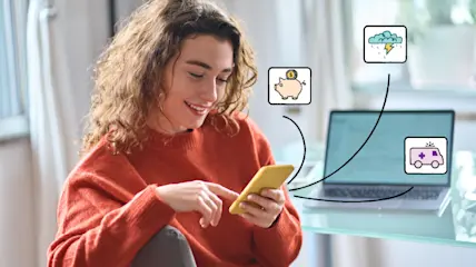 Woman organizing her money into different saving funds.