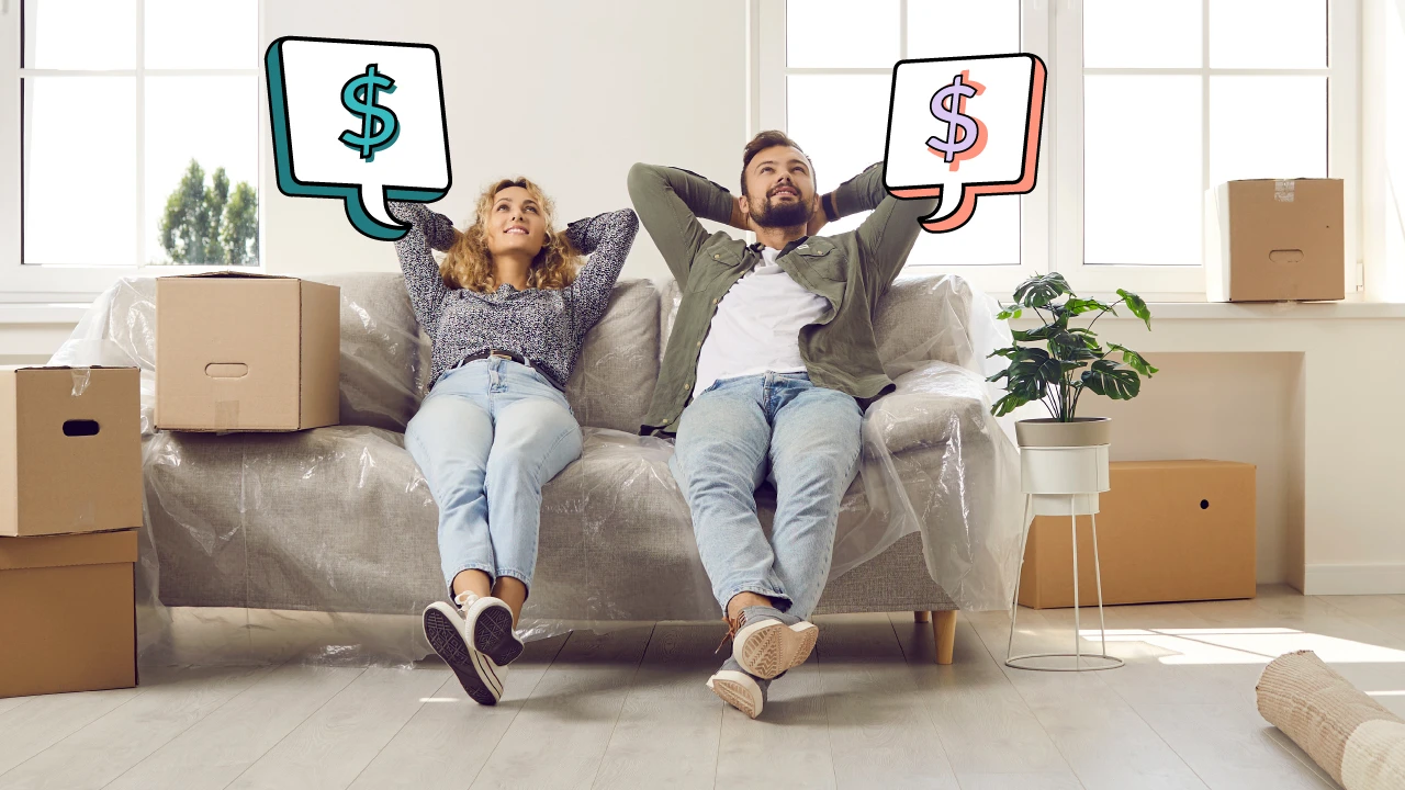 Man and woman sitting on a couch in their new home.