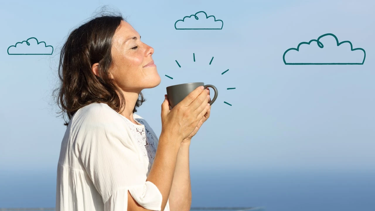 Woman holding a coffee cup 