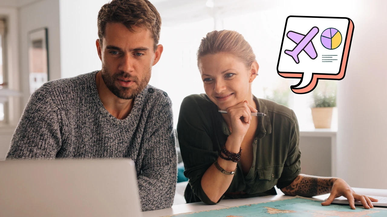 Couple researching a trip on a laptop. 