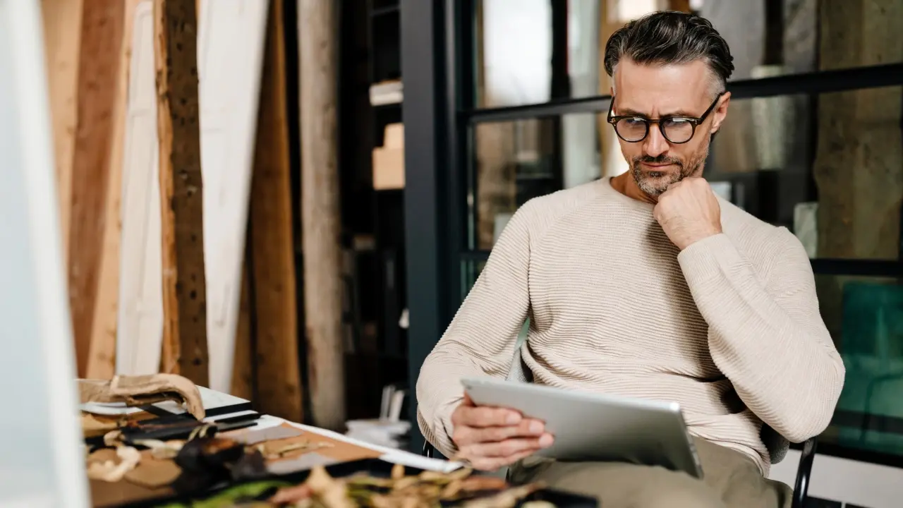 Man reading on a tablet computer. 