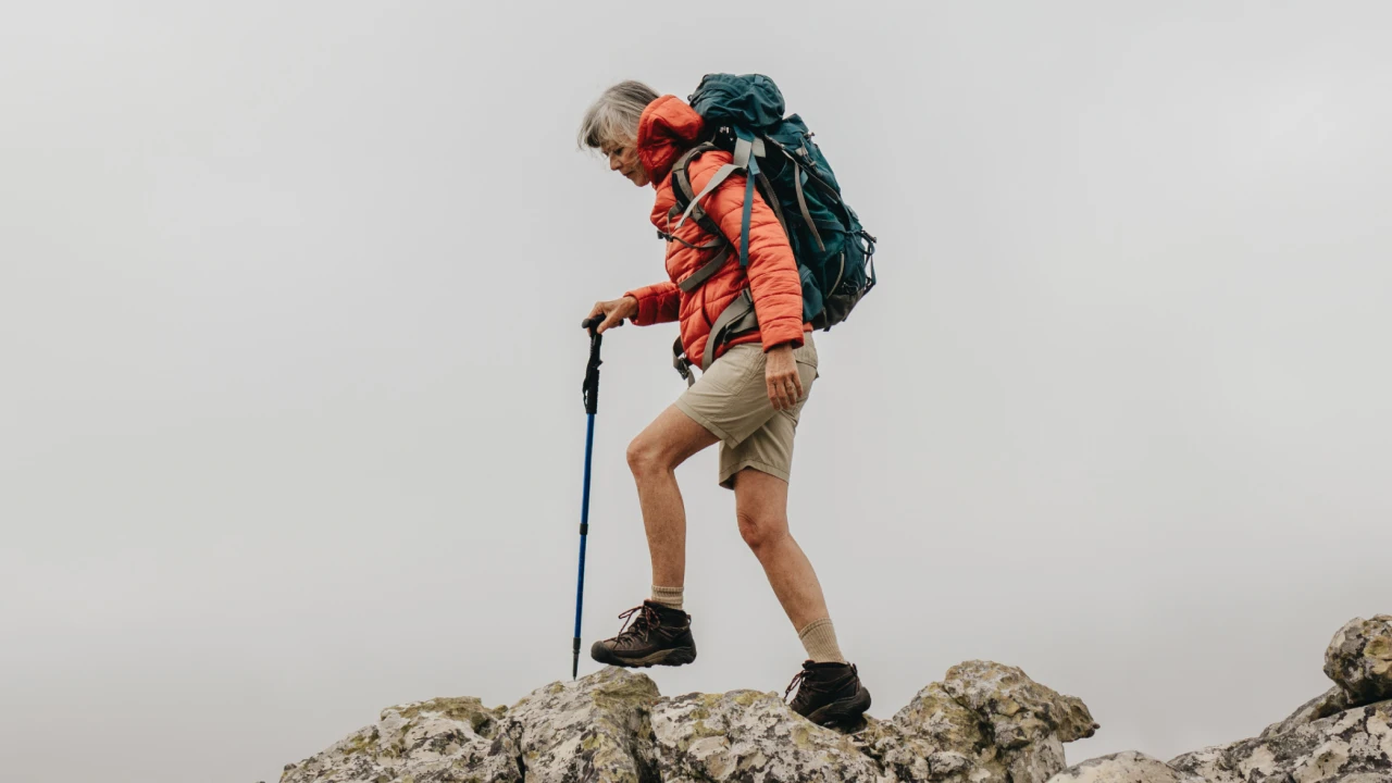 Woman hiking on a mountain. 