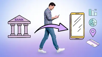 Man walking past a bank and managing finances on his cell phone.