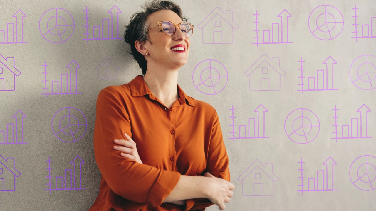 Woman leaning against a wall with different financial graphs. 