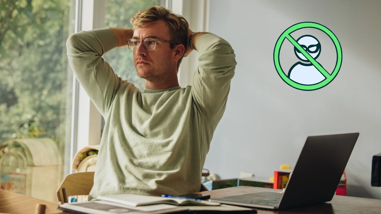 Man sitting at a desk with his laptop.